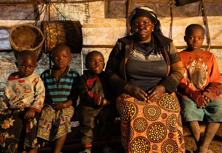 Displaced voices: Fela Mbahibwe escapes violence with her children on her back