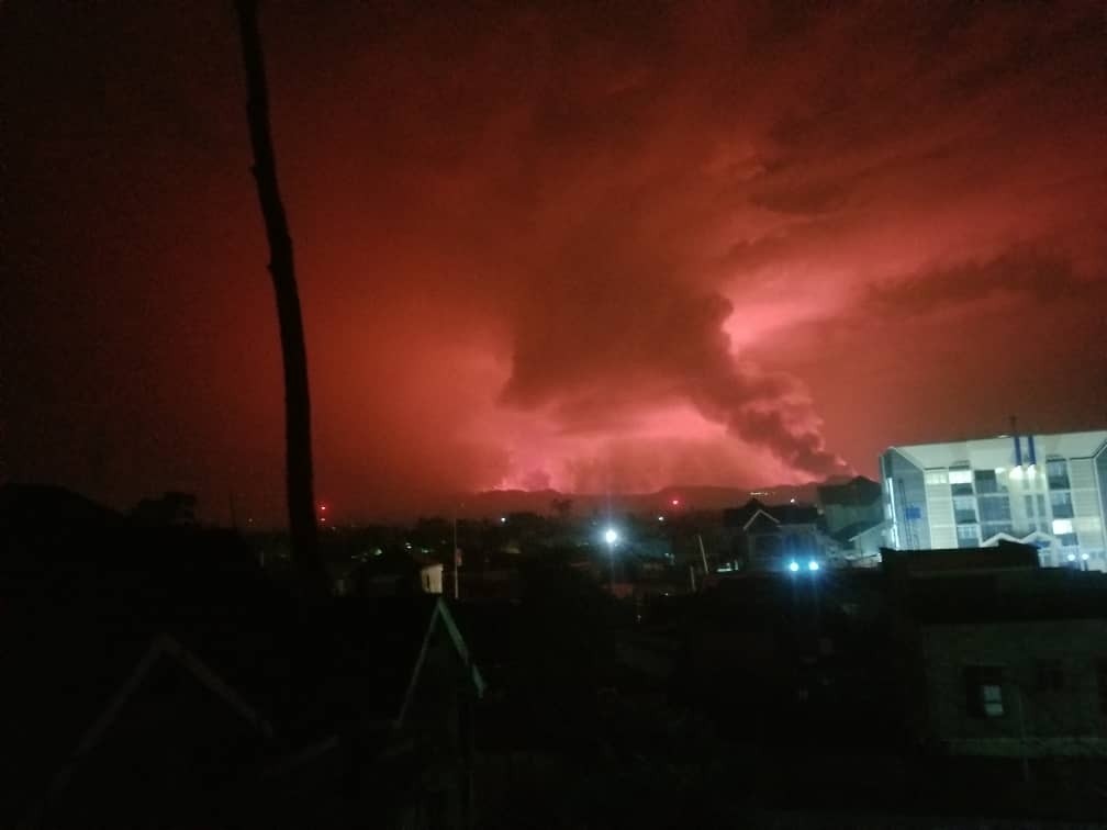 Red skies and smoke over an apartment building near the city of Goma