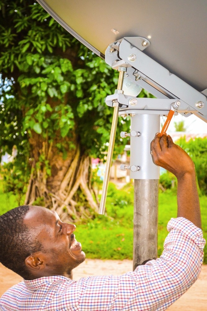 A man installs a satellite
