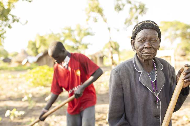 Philip Bidal, 17, and his grandmother, Acii Paulina, who is in her 80s, are refugees from South Sudan living in Palabek Refugee Settlement in northern Uganda. They received improved seeds and agricultural training from Lutheran World Relief to help diversify their diet and increase their income. (Photo by Jake Lyell)