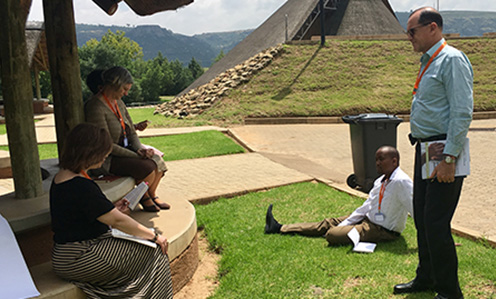 Panel attendees split into two groups for contextual Bible study as part of the pre-conference workshop about ways faith-based organizations can be instrumental in addressing sexual and gender-based violence. (Kara Eberle/IMA World Health)