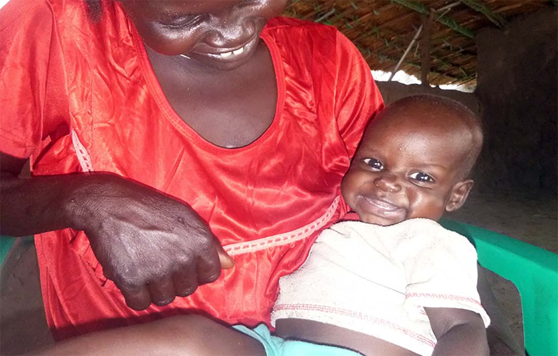 Teer was suffering from severe malnutrition when he was admitted to a nutrition stabilization center in Poktap, South Sudan. After two months of treatment, he was a happy and healthy little boy. (Photo courtesy of John Dau Foundation)