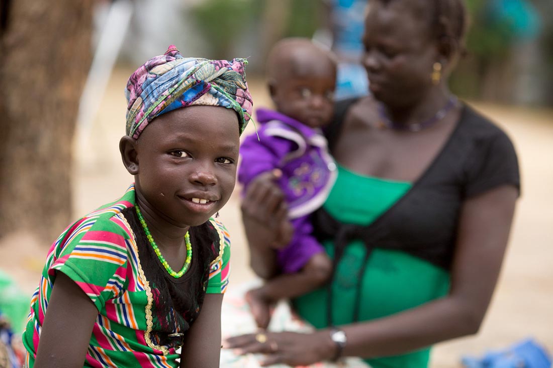 Families wait their turn in an outdoor waiting area as a team conducts malnutrition assessments of young children and lactating mothers and hands out nutritional supplements at the John Dau Foundation compound in Duk Padiet in South Sudan's Jonglei state, September 29, 2017. Lutheran World Relief has partnered with IMA World Health and in turn, the John Dau Foundation, to set up and run three life-saving medical stabilization centers, including one that will be on this site, that will allow for the indoor treatment of young children and lactating mothers at risk of death from starvation. The project, called “Providing Emergency Nutrition Services in South Sudan” will reach just under 100,000 individuals. (photo by Allison Shelley for Lutheran World Relief)